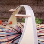 Clothespins and clamps holding a hoop fin's foam core during lamination